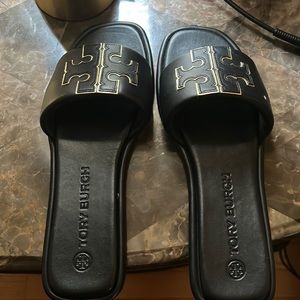 Black worn one Time Tory Burch sandal like new.